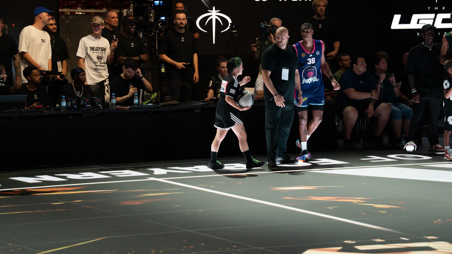 A young fan joining the players on the Munich court